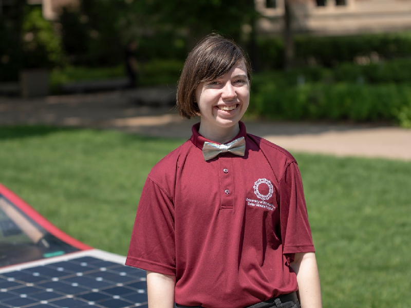 Amethyst standing in front of Solar Car Eos 2